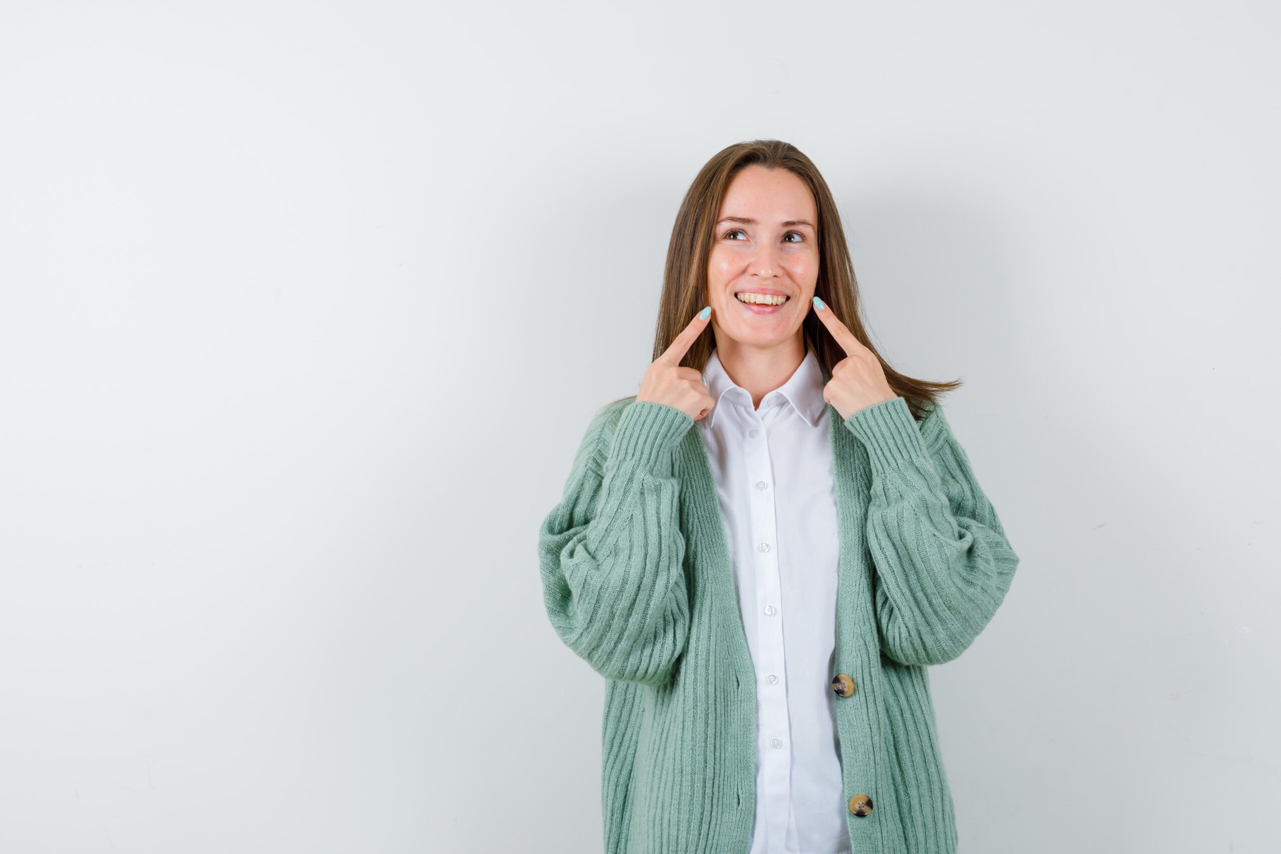 expressive-young-woman-posing-studio-min